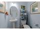 Bathroom with pedestal sink, toilet, and rack featuring a painting for character at 712 Portstewart Dr, Cary, NC 27519