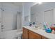 Cozy bathroom with tub and shower featuring vanity with sink and soft blue walls at 712 Portstewart Dr, Cary, NC 27519