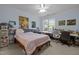 Bright bedroom featuring a comfortable bed, large window, and ample workspace at 712 Portstewart Dr, Cary, NC 27519