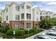 Charming multi-story condo with brick accents, complemented by lush landscaping and reserved parking spaces at 712 Portstewart Dr, Cary, NC 27519