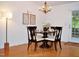 Cozy dining area illuminated by a chandelier and natural light at 738 Aspenwood Dr, Graham, NC 27253