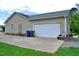 A two-car garage with a white door and ample driveway space at 738 Aspenwood Dr, Graham, NC 27253