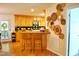 Charming kitchen with wooden cabinets and a breakfast bar at 738 Aspenwood Dr, Graham, NC 27253