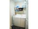 Practical laundry room with washer, dryer, and shelving at 738 Aspenwood Dr, Graham, NC 27253