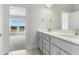 Bathroom view into bedroom with large windows and lots of natural light at 745 Aristocrat Ln, Knightdale, NC 27545