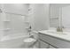 Well-lit bathroom with a tub and shower combination and a vanity with modern fixtures at 745 Aristocrat Ln, Knightdale, NC 27545
