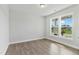 Bright, sunlit bedroom with wood floors and large windows at 745 Aristocrat Ln, Knightdale, NC 27545