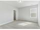 Carpeted bedroom with neutral paint and a window allowing for natural light at 745 Aristocrat Ln, Knightdale, NC 27545