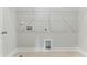 Walk-in closet with shelving, tile floor, and modern utility connections at 745 Aristocrat Ln, Knightdale, NC 27545