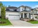 Charming two-story home with a manicured lawn and a two-car garage at 745 Aristocrat Ln, Knightdale, NC 27545