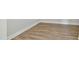 Close-up of wood-look flooring and modern base trim throughout the home at 745 Aristocrat Ln, Knightdale, NC 27545