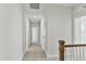 Second floor hallway with plush carpet, white walls and ceilings, and multiple rooms at 745 Aristocrat Ln, Knightdale, NC 27545