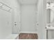 Hallway with a hall tree, leading to a bathroom at 745 Aristocrat Ln, Knightdale, NC 27545