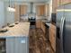 Charming kitchen with stainless steel appliances, a large island, and wood grain cabinets at 765 Whitley Rd, Middlesex, NC 27557
