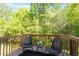 Relaxing balcony with seating overlooking lush greenery, perfect for enjoying the outdoors at 7838 Spungold St, Raleigh, NC 27617