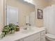 Bright bathroom with white vanity, framed mirror, shower with curtain, and tasteful decor at 7838 Spungold St, Raleigh, NC 27617