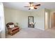 Inviting bedroom with a neutral color scheme, comfortable armchair, and stylish decor at 7838 Spungold St, Raleigh, NC 27617