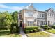 Inviting townhouse with brick and siding, featuring well-maintained landscaping and a welcoming entrance at 7838 Spungold St, Raleigh, NC 27617