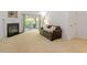 Cozy living room with a fireplace, sliding glass doors leading to a patio, and comfortable seating at 7838 Spungold St, Raleigh, NC 27617