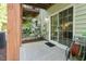Covered patio area with sliding glass doors, offering easy access to the backyard and outdoor living space at 7838 Spungold St, Raleigh, NC 27617
