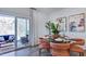 Cozy dining area with patio access, stylish furnishings, and abundant natural light at 8724 Wardle Ct, Wake Forest, NC 27587