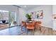 Cozy dining area with patio access, stylish furnishings, and abundant natural light at 8724 Wardle Ct, Wake Forest, NC 27587