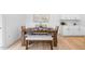 Bright dining area featuring a wood table, comfortable seating and bright walls at 8724 Wardle Ct, Wake Forest, NC 27587