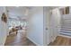 Hallway view into the living room with hardwood floors and stairs at 8724 Wardle Ct, Wake Forest, NC 27587