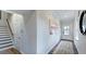 Inviting entryway with hardwood floors, staircase, neutral walls, and natural light at 8724 Wardle Ct, Wake Forest, NC 27587