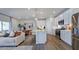 Open-concept kitchen with stainless steel appliances, a large island, and a breakfast bar for casual dining at 8724 Wardle Ct, Wake Forest, NC 27587