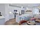 Open-concept kitchen featuring stainless appliances, white cabinets, and a view of the dining area at 8724 Wardle Ct, Wake Forest, NC 27587