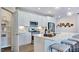 Stylish kitchen with white cabinets, stainless steel appliances, a large pantry, and decorative elements at 8724 Wardle Ct, Wake Forest, NC 27587