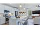 Modern kitchen with stainless appliances, a center island with seating, and an open floor plan at 8724 Wardle Ct, Wake Forest, NC 27587