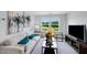 Comfortable living room with large windows offering natural light and views of the surrounding landscape at 8724 Wardle Ct, Wake Forest, NC 27587