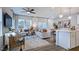 Sunlit open-concept living space with hardwood floors, stylish furniture, and modern accents at 8724 Wardle Ct, Wake Forest, NC 27587
