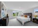 Spacious main bedroom with large windows, plush carpeting, and elegant decor at 8724 Wardle Ct, Wake Forest, NC 27587