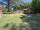 Expansive backyard featuring a quaint shed with covered porch, perfect for relaxing outdoors at 901 Vandora Ave, Garner, NC 27529