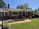 Inviting front entrance with landscaped garden and brick walkway at 901 Vandora Ave, Garner, NC 27529