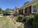 Brick home featuring well-manicured landscaping and a convenient carport at 901 Vandora Ave, Garner, NC 27529
