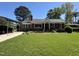 Charming brick home with a well-manicured lawn and a convenient carport at 901 Vandora Ave, Garner, NC 27529