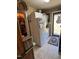 Laundry area featuring a washer, dryer, refrigerator, and access to the outdoors at 901 Vandora Ave, Garner, NC 27529