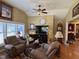Cozy living room featuring warm tones, hardwood floors and an elegant ceiling fan at 901 Vandora Ave, Garner, NC 27529