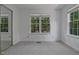 Bright bedroom features two windows offering natural light and neutral carpeting at 497 Summerwalk Cir # 497, Chapel Hill, NC 27517