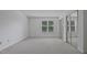 Bedroom with carpet, bright window light, and a closet with sliding mirrored doors at 497 Summerwalk Cir # 497, Chapel Hill, NC 27517
