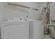 Practical laundry room includes washer, dryer, and water heater for convenience at 497 Summerwalk Cir # 497, Chapel Hill, NC 27517