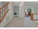 Open-concept floor plan to the outdoor patio and a kitchen area at 497 Summerwalk Cir # 497, Chapel Hill, NC 27517