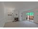 Living room featuring a fireplace, built-in shelves, and sliding glass doors to the outside at 497 Summerwalk Cir # 497, Chapel Hill, NC 27517