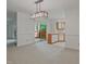 Open concept living area that combines both the kitchen and access to the outdoor patio at 497 Summerwalk Cir # 497, Chapel Hill, NC 27517