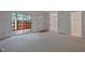 Spacious living room with sliding glass doors leading to a patio, and doorway view to kitchen at 497 Summerwalk Cir # 497, Chapel Hill, NC 27517