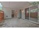 Covered outdoor patio featuring sliding glass doors and an entrance door at 497 Summerwalk Cir # 497, Chapel Hill, NC 27517